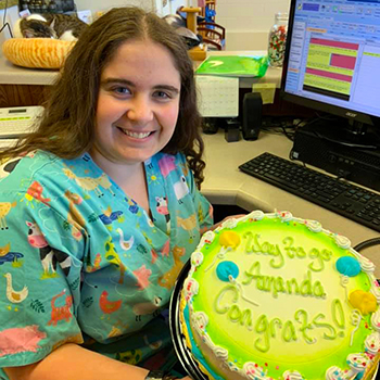 Veterinary technician, Amanda Coehoorn, with her cake