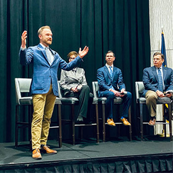 Dr. Aaron Smiley speaking at an event