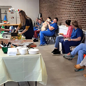 The Muddy Creek team celebrating Kelsey before her move to Pennsylvania