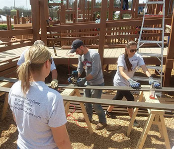Brookside NY team helps build a playground